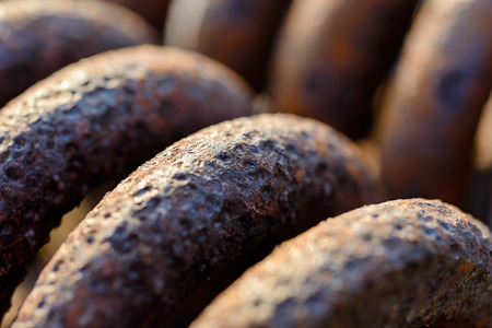 Backgrounds and textures: rusty metal spring surface, selective focus macro shot, industrial abstractの写真素材