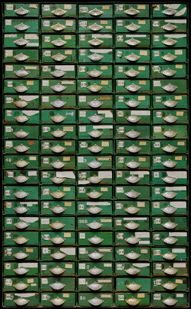 Backgrounds and textures: very old green metal cabinet with wooden drawers