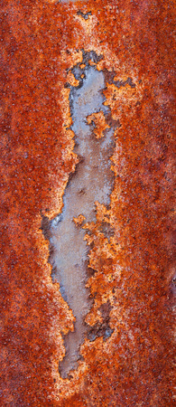 Backgrounds and textures: macro shot of rust on old paint, artistic pattern, industrial or organic...