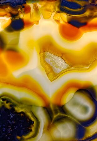 Backgrounds and textures: surface of agate or chalcedony, beautiful decorative stone, abstract pattern of cracks, spots and stains, natural backgroundの写真素材