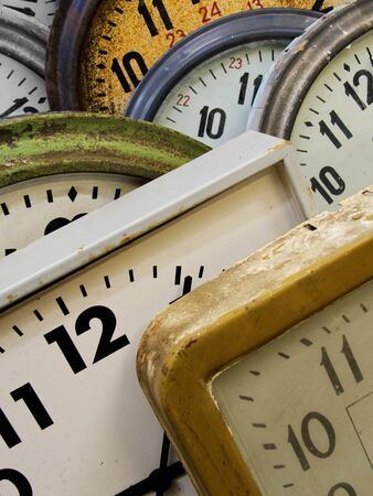 Backgrounds and textures: group of very old broken wall clocks, close-up shotの写真素材