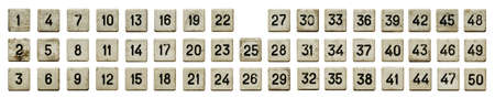 Very old numeric keypad, set of white plastic buttons, numbered from 1 to 50, isolated on white...