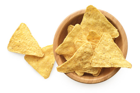 Corn chips in wooden bowl, isolated on white background