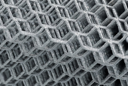 Openwork three-dimensional lattice, matrix, shallow depth of field, abstract modern technology concept backgroundの写真素材