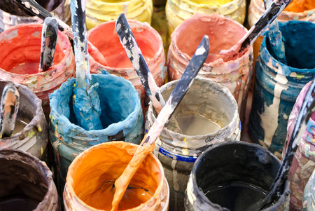 Large group of open old dirty cans of multi-colored paints, horizontal crop, abstract artistic backgroundの写真素材