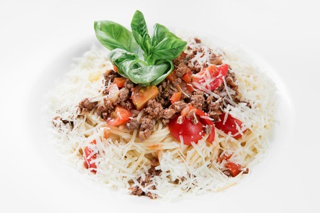Spaghetti pasta with bolognese sauce and parmesan cheese.