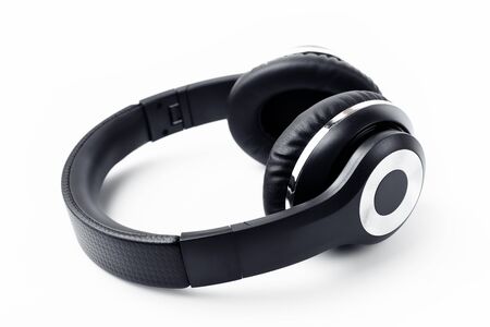 Black stylish professional wireless headphone on white background. High-quality music studio headset.の写真素材