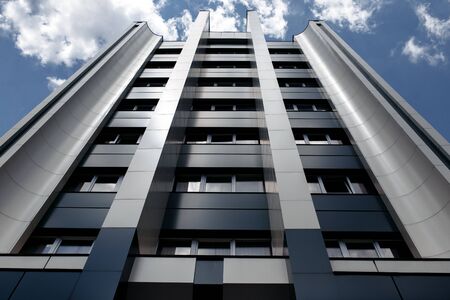 Photo of looking up modern metallic wall business or office building