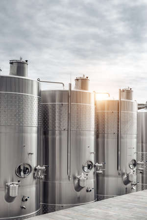 Modern stainless steel barrels for wine fermentation at a winery. Wine industry.の写真素材