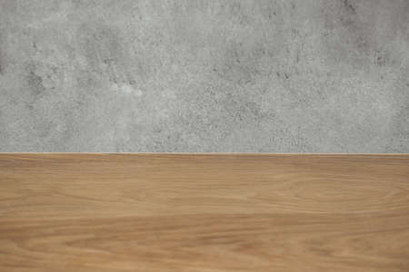 Stylish texture of old gray concrete glossy wall and wooden surface for background. Copy space.