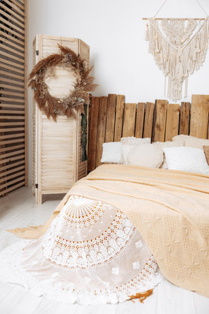 Photo of interior design spacious bright studio in Scandinavian style and warm pastel white and beige colors.の写真素材