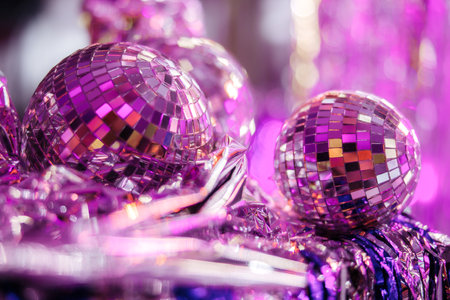 Group of shining disco balls on the floor in neon light. Party concept.の写真素材