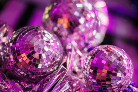 Shining disco balls on the floor in neon light. Party concept.の写真素材