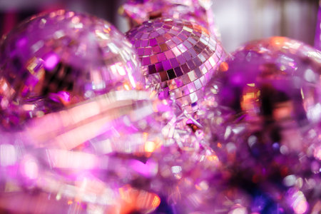 Shining disco balls on the floor in neon light. Party concept.の写真素材