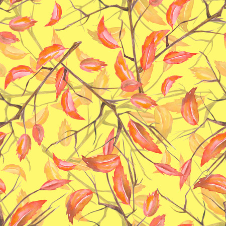 A seamless pattern with a floral ornament of the watercolor red autumn leaves on the branches on a yellow backgroundの写真素材