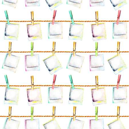 Seamless pattern with watercolor instant camera snapshots attached with clothespins to the ropes, hand drawn isolated on a white backgroundの写真素材