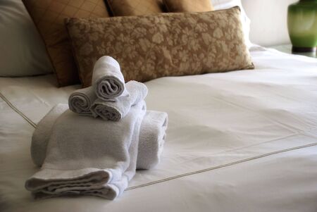 Luxury Hotel Room Bed with Towelsの写真素材