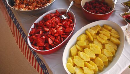 A patriotic table with fruit served in bowls at a picnicの写真素材