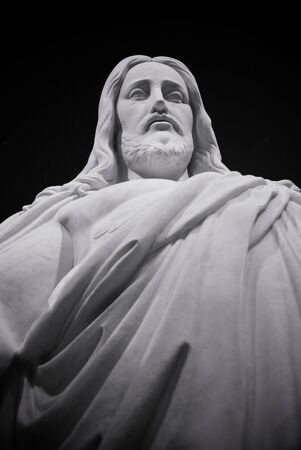 Looking up a the face of a statue of Jesus Christの写真素材