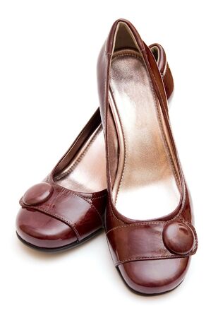 The pair of brown womans shoes isolated on white backgroundの写真素材