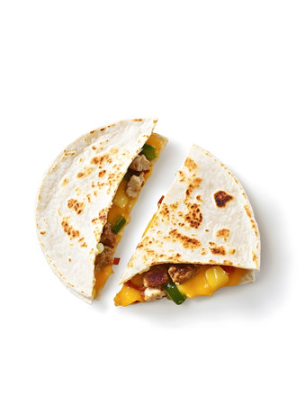 Mexican quesadilla with meat and vegetables isolated on white backgroundの素材