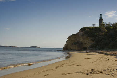 Lighthouse on the shoreの写真素材