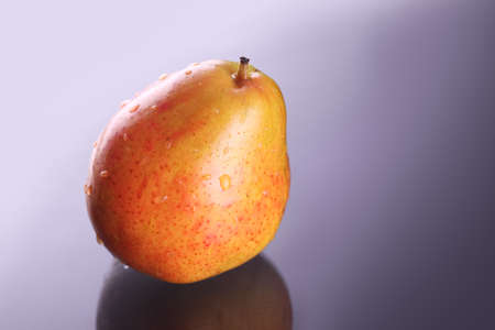 Fresh orange pear with waterdropsの写真素材