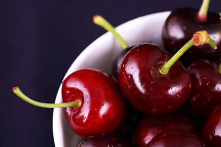 Red fresh cherries in the bowl