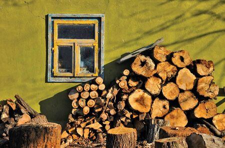 The firewood near the wall with windowの写真素材