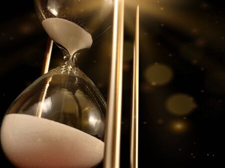 Hourglass on a stand, black background. Glass hourglass in the case. Glass time meter. Concept: time...