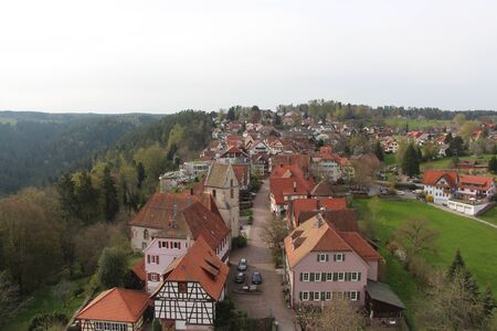 A small European city on top of a mountain. Medieval residential buildings in a forest among nature. Historic city, Germany, April 2016.のeditorial素材