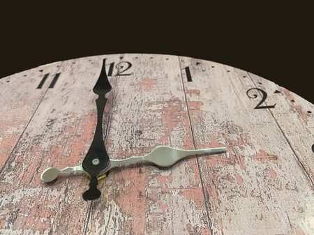 Dial with arrows on an old watch, close-up. Antique clock with a big and small arrow. Concept: the...