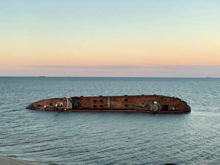 A sunken ship off the Black Sea coast in Odessa. The tanker drowned near Dolphin Beach. Concept: shipwreck, disaster, accident.の写真素材