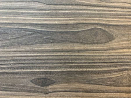 Background texture: the structure of a wooden surface. Decorative laminated board, close-up. Material for making furniture.の写真素材