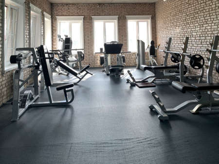 Gym for bodybuilding. Heavy dumbbells and exercise equipment. Barbells and equipment for athletes. Irpin, "Champion" gym, August 15, 2020のeditorial素材