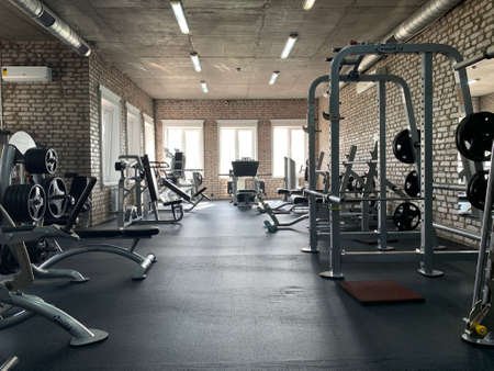 Gym for bodybuilding. Heavy dumbbells and exercise equipment. Barbells and equipment for athletes. Irpin, "Champion" gym, August 15, 2020のeditorial素材