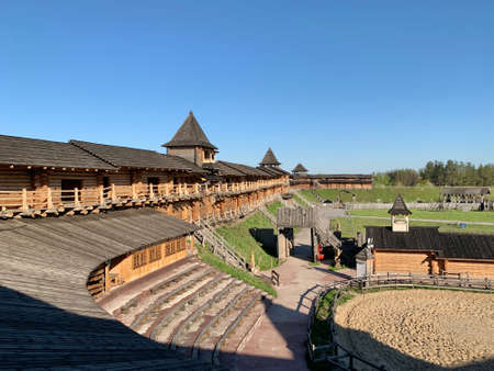 Wooden fortress wall against the sky. Medieval fortress with high walls. Wooden installation in the...