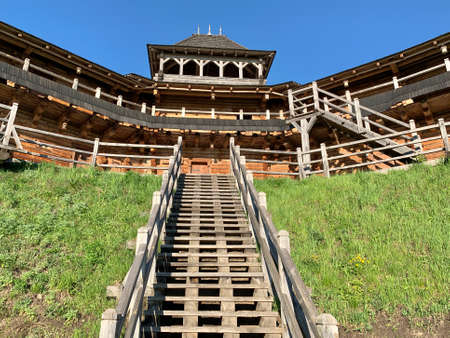 Wooden fortress wall against the sky. Medieval fortress with high walls. Wooden installation in the style of an ancient city. Park "Kievan Rus" Kiev region, Obukhov district, village Kopachevo, May 10, 2021.の写真素材