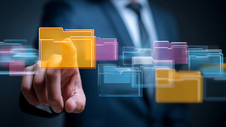Person in formal attire interacts with transparent digital folders in a modern workspace, showcasing digital organization and technology in a professional environmentの素材
