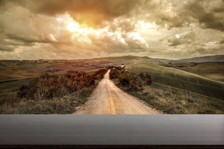 Mood fall photo of Tuscany landscape. Empty space background for you products and decoration. A picturesque road among the treses.の写真素材