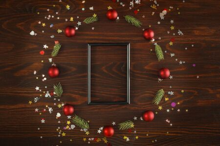 Christmas decorations on a flat winter background. Space for advertising products, decorations and text. Spruce twigs and small baubles.の写真素材