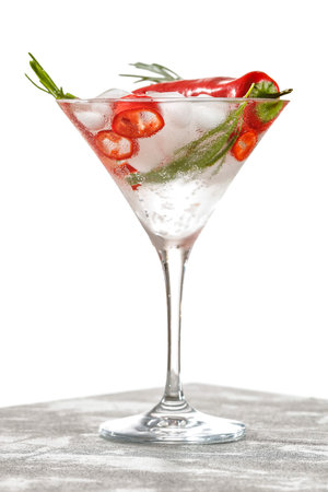 Cocktail with red pepper and rosemary on a white backgroundの写真素材