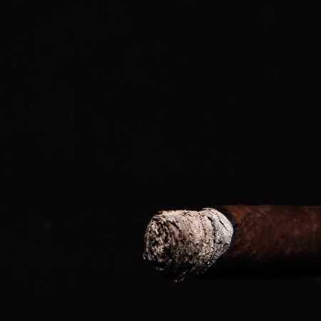 cigar with smoke on black background cubaの写真素材