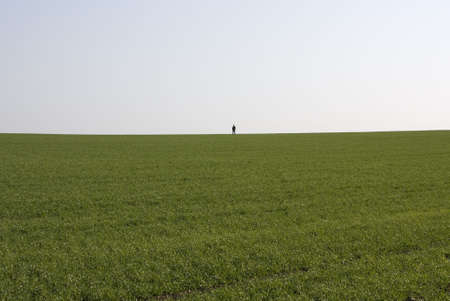 Lonely man in the fieldの写真素材