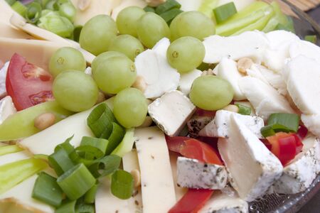 Cheese plate and grapes - dietary lunchの写真素材