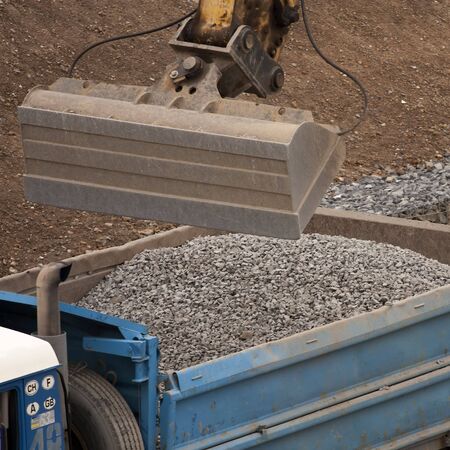 Dipper working with gravel on a construction siteの写真素材