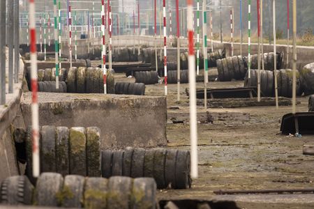 Closed and waterless wild water canal in winterの写真素材