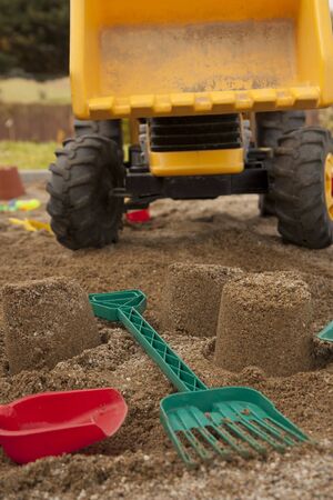 Sandpit with toys - strewed tools