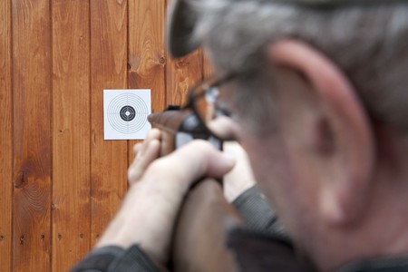 Man shooting with air gun 