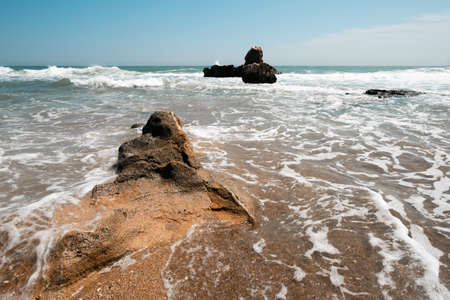 A stone looking at the foaming sea, Las Rotas, Denia.の写真素材